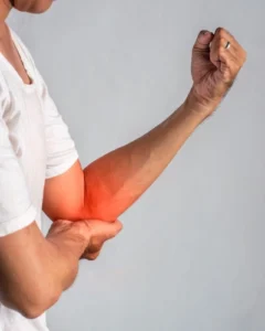 A person with golfer's elbow pain